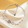 Sterling Silver Infinity Bracelet with Pearls and Dual-Tone CZ