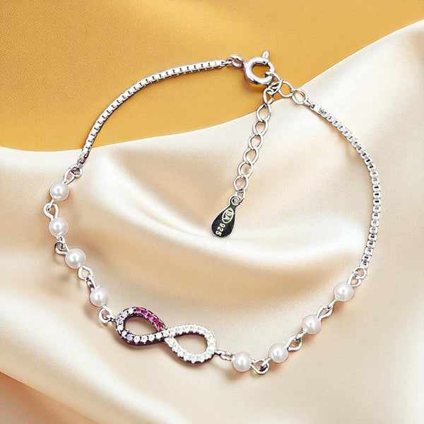 Sterling Silver Infinity Bracelet with Pearls and Dual-Tone CZ
